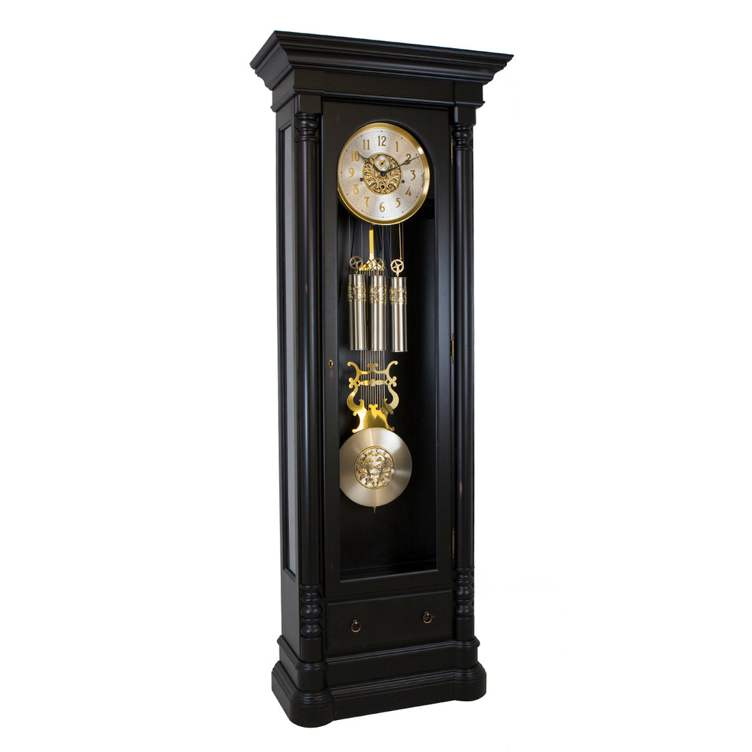 Black grandfather clock with brass and brushed nickel highlights on a white background