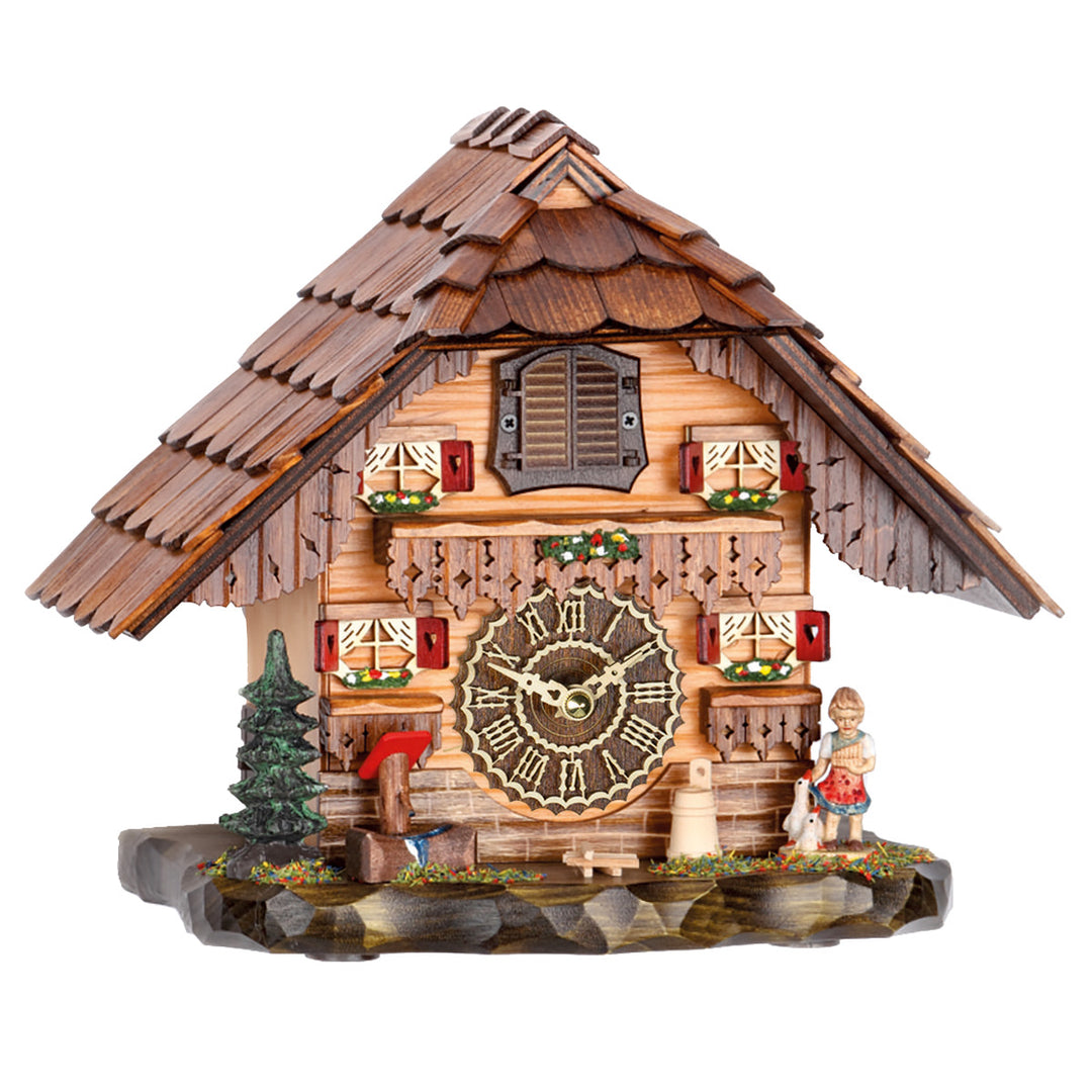 Cuckoo clock with wooden shingles, green pine tree and girl with ducks figurine on white background.