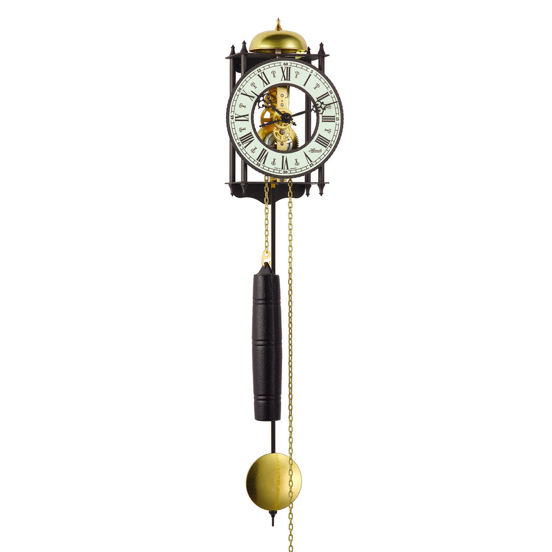 Black skeleton clock with brass mechanical movement and black weight on white background