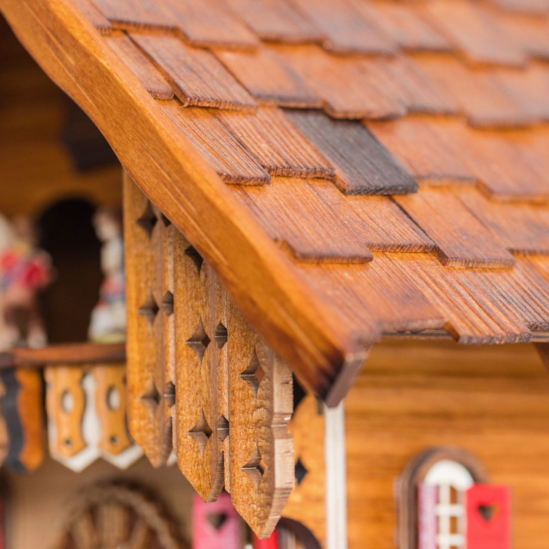 Close up of wooden shutters on the roof of cuckoo clock 