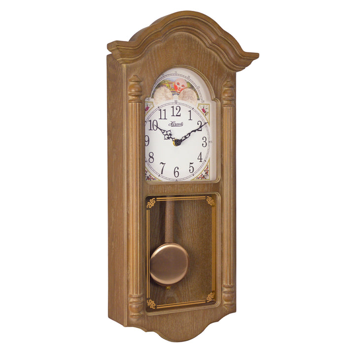Wooden wall clock with brass finish pendulum, arabic numerals and illustrated moon dial on white background.