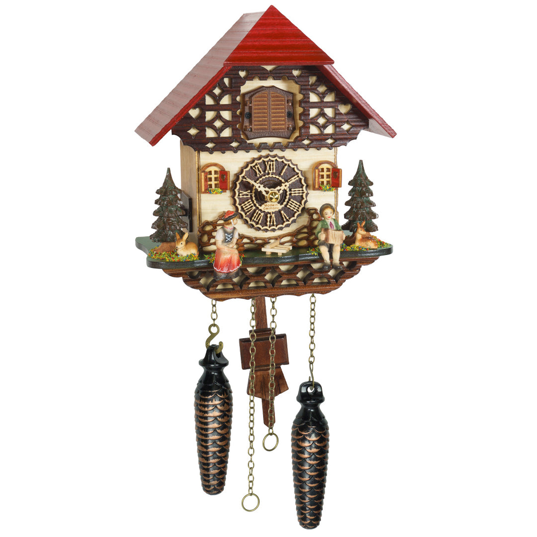 Decorative cuckoo clock with red roof and roman numeral face on a white background
