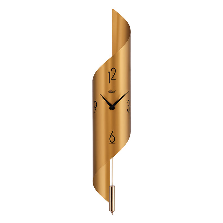 Gold finish abstract clock with brass finish pendulum and arabic numerals on white background.