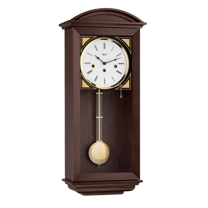 Retro style walnut wall clock with brass highlights and three holes in the face for winding the mechanical movement inside.