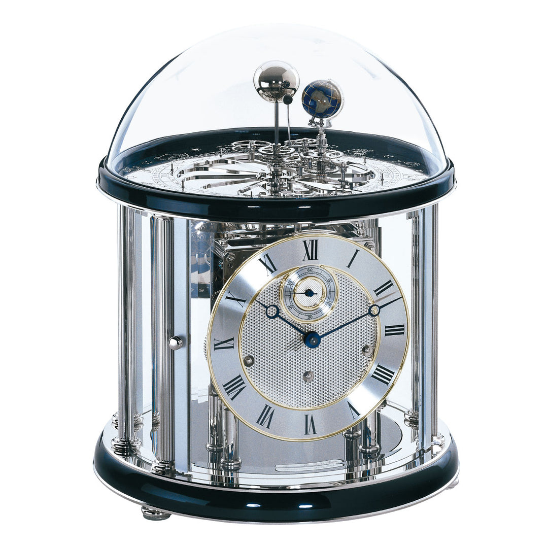 Black and silver mechanical  Tellurium clock with glass dome and nickel plated gears visible on white background