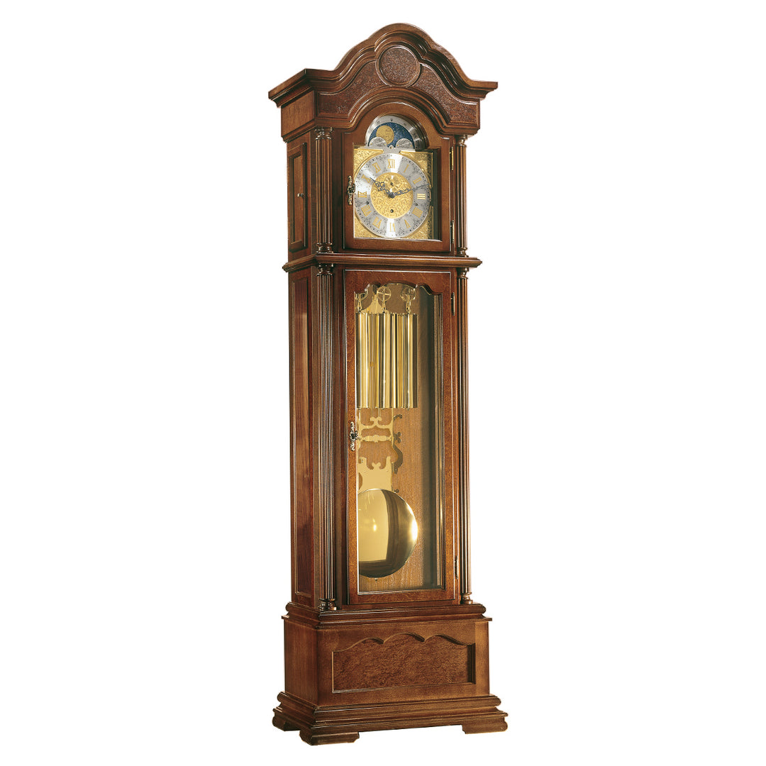 Intricate wooden grandfather clock with roman numeral lock face and brass pendulum on a white background
