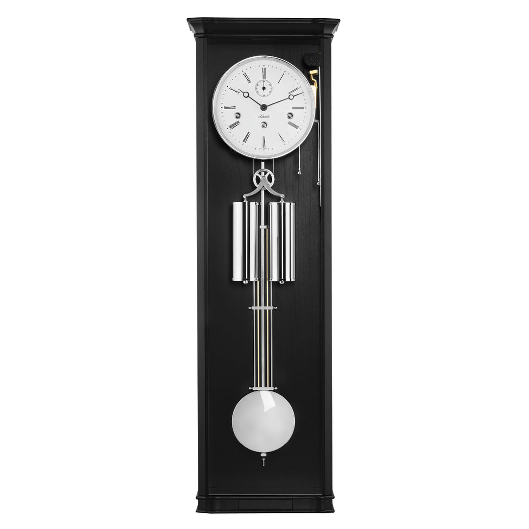 Black regulator wall clock with silver highlights and white face on white background