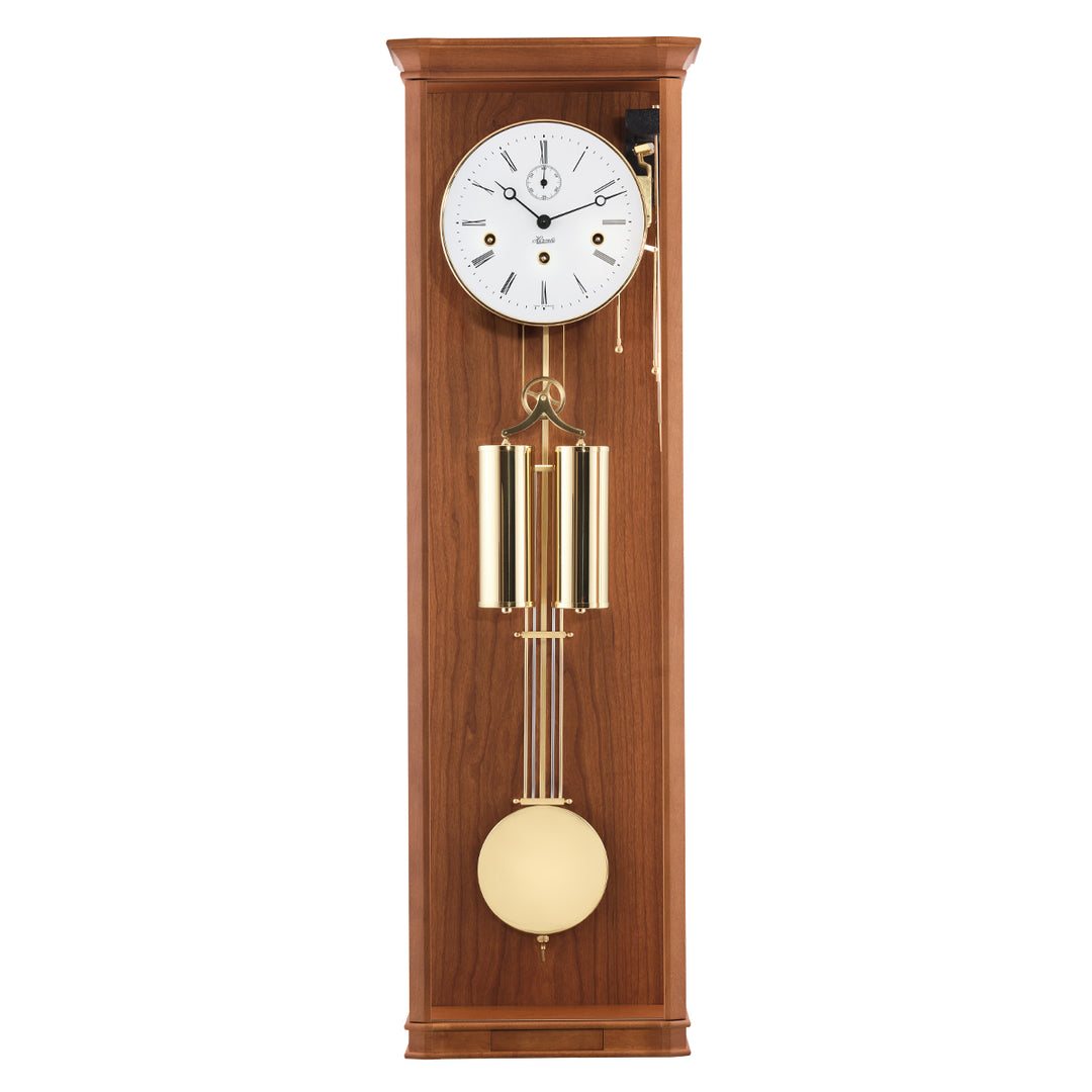 Light cherry wood regulator wall clock with brass highlights and white face on white background