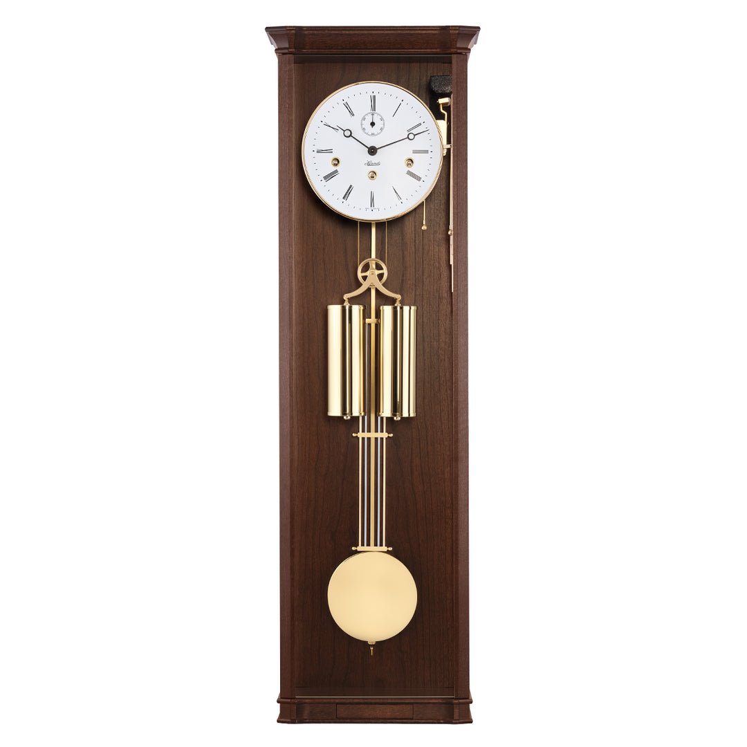 Walnut wood regulator wall clock with brass highlights and white face on white background