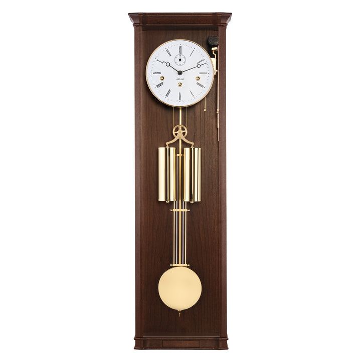 Walnut wood regulator wall clock with brass highlights and white face on white background