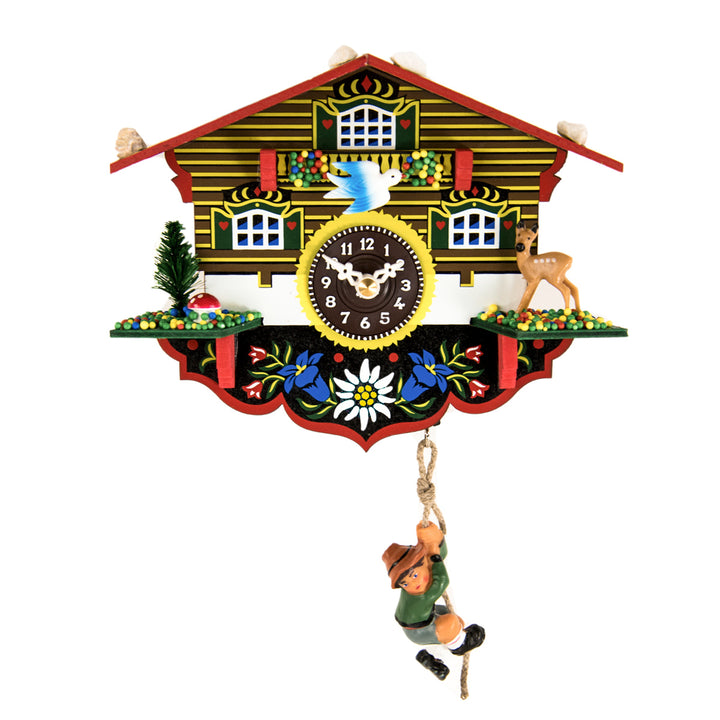 Decorative cuckoo clock with a house design, and a boy climbing a rope