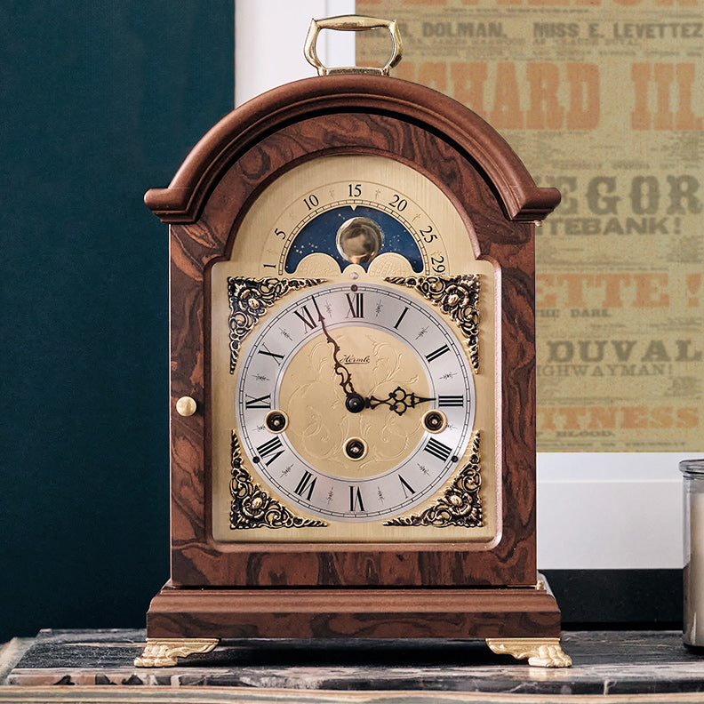 Vintage style luxury walnut mantel clock with traditional clock face, featuring moon phase dial.