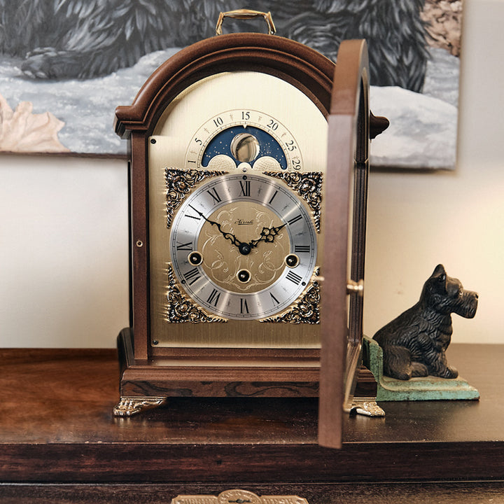 Front view of vintage style luxury walnut Aimee mantel clock with open front door.