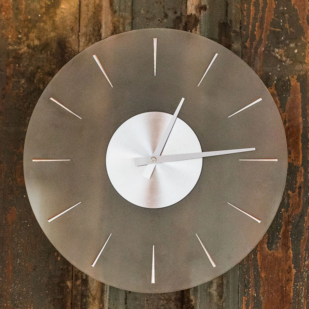 Finley transparent wall clock on wood wall.
