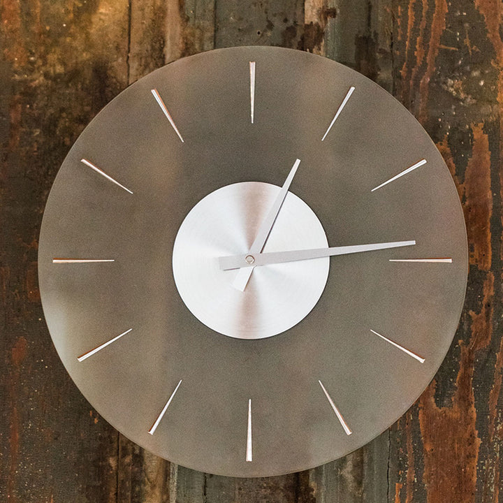 Finley transparent wall clock on wood wall.
