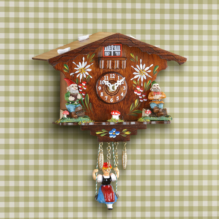 Traditional German cuckoo clock:  Annaliesse on plaid wall. 