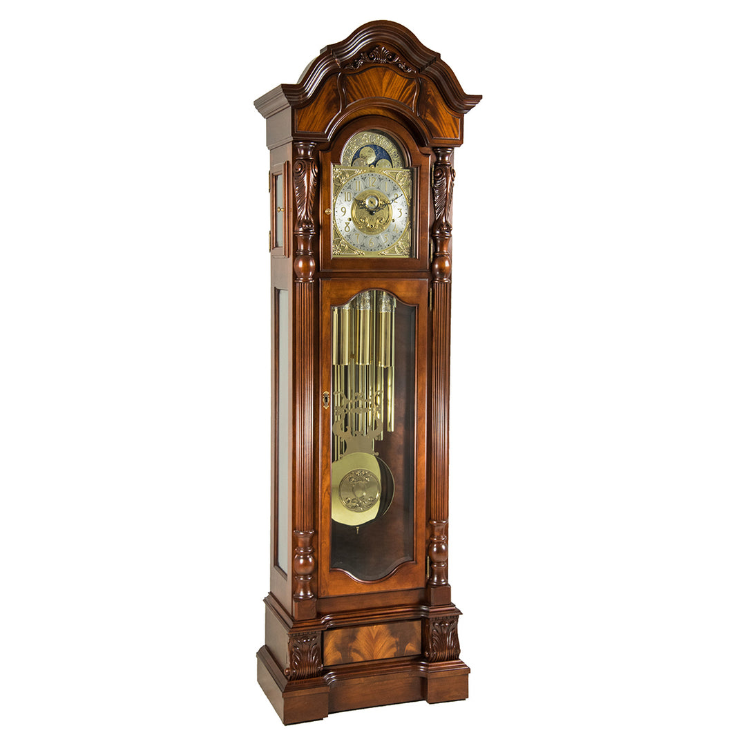 Wooden grandfather clock by Hermle with intricate design, on a white background