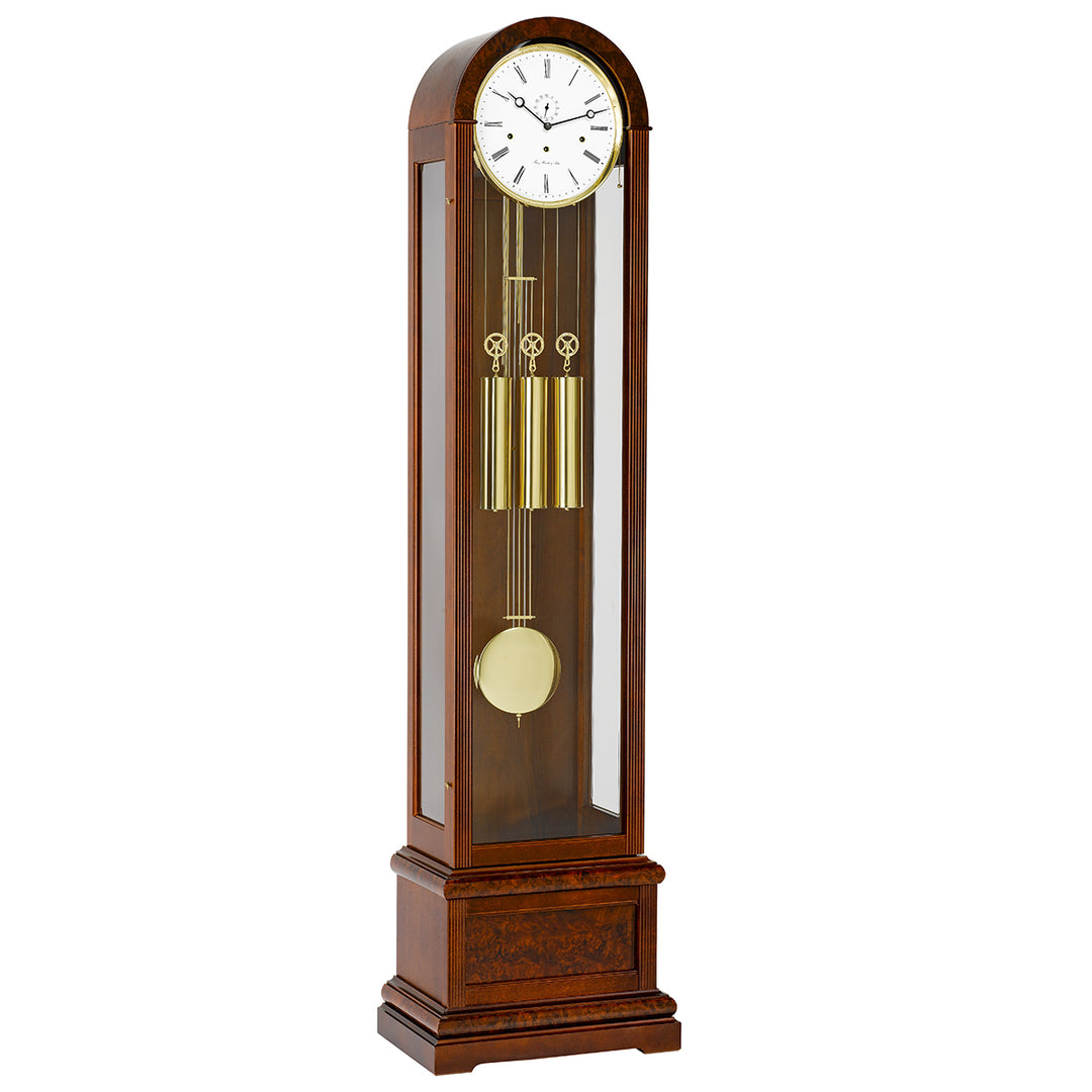 Wooden Charlotte grandfather clock by Hermle with a white face on a white background