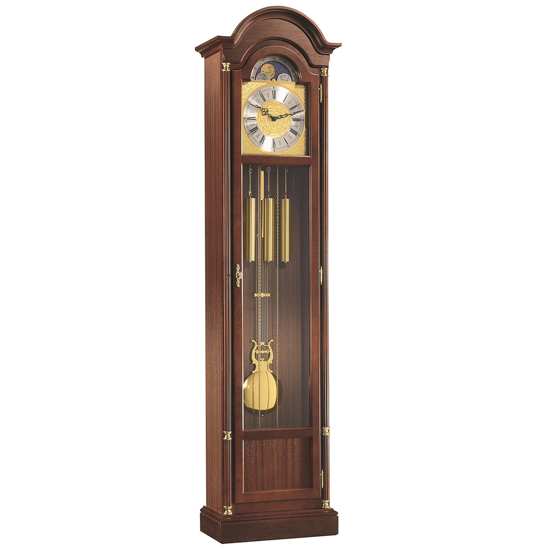 Wooden Longwood grandfather clock by Hermle with pendulum and glass front on a white background