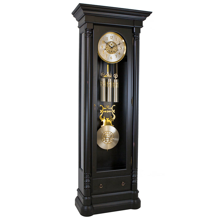 Black grandfather clock with gold accents on a white background