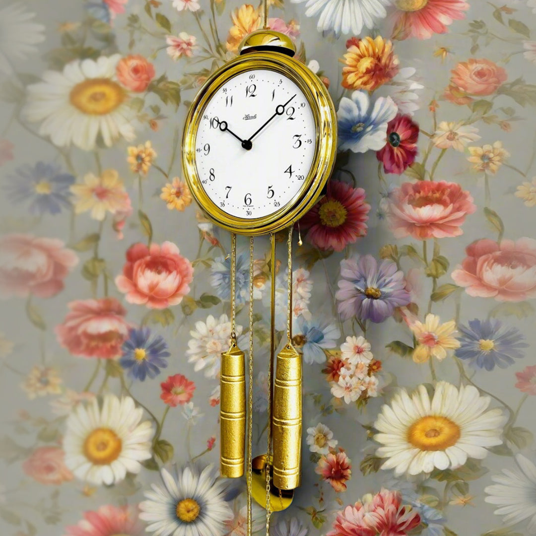Gold skeleton wall clock by Hermle