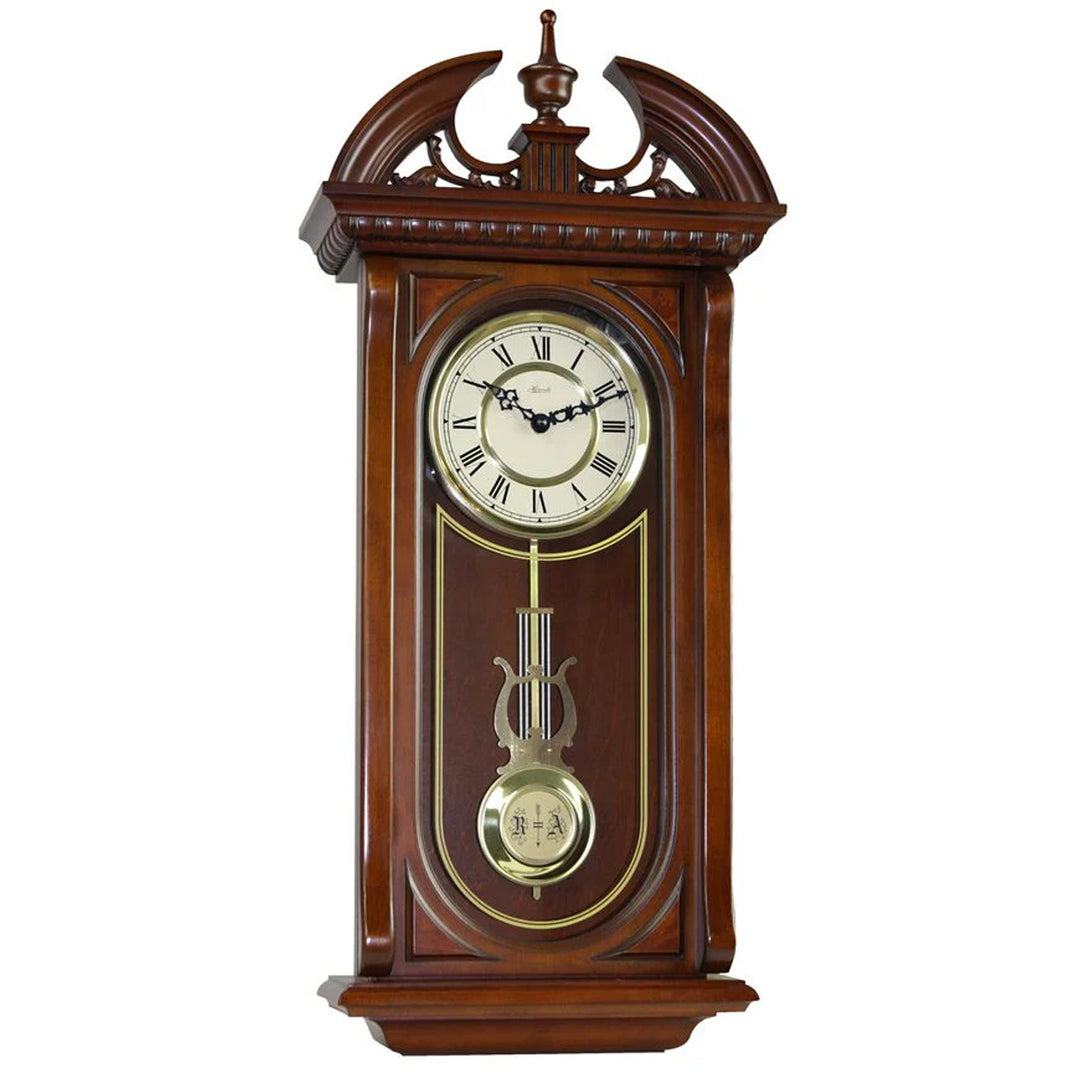 Wooden wall clock with decorative elements on a white background